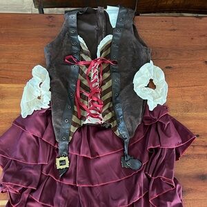 sexy swashbuckler women’s pirate costume includes top sleeves and skirt. Size M